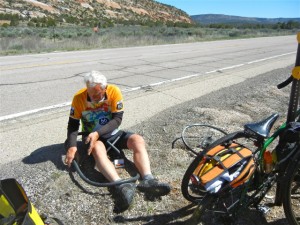 Biker fixing tire